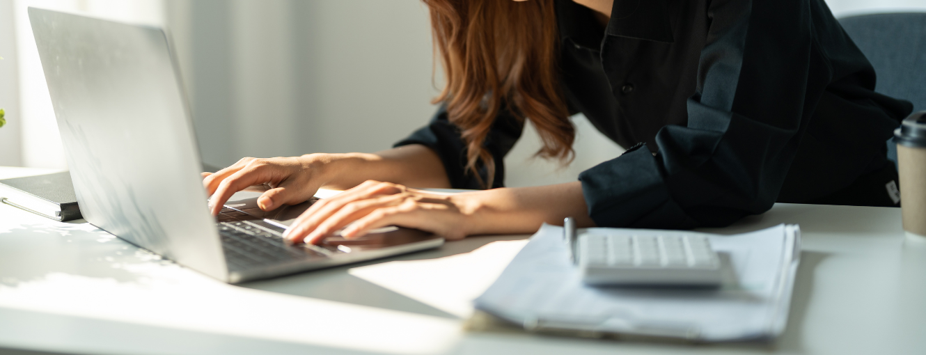 Woman paying bills on a laptop