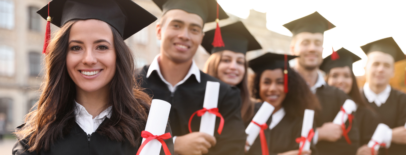 Group of young adults graduating